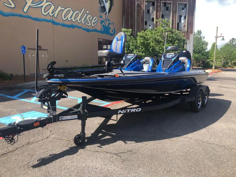 Slide: The Image of 2025 Nitro Z20 XL boat on trailer in parking lot. - 14