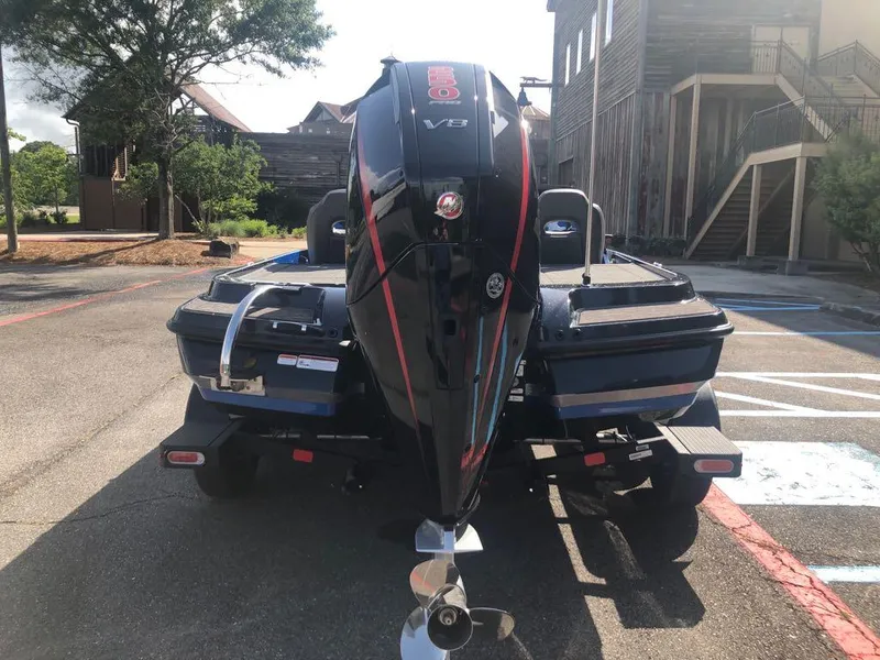 Slide: The Image of 2025 Nitro Z20 XL boat with powerful V8 engine, parked outdoors. - 2