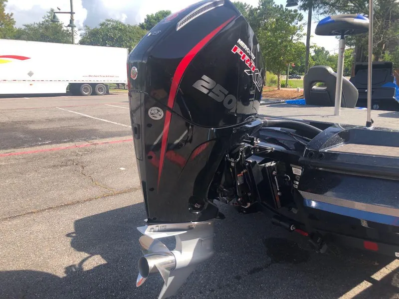 Slide: The Image of 2025 Nitro Z20 XL boat with Mercury 250 Pro XS outboard motor in a parking lot. - 3