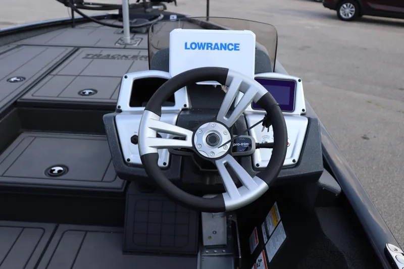 Slide: The Image of Steering console of 2025 Tracker Savage 215 boat with Lowrance electronics. - 13