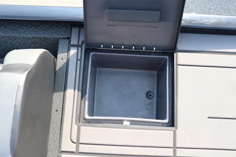 Slide: The Image of Open storage compartment on 2025 Tracker Savage 215 boat deck. - 16