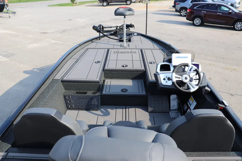 Slide: The Image of 2025 Tracker Savage 215 boat interior with steering wheel and seating. - 19