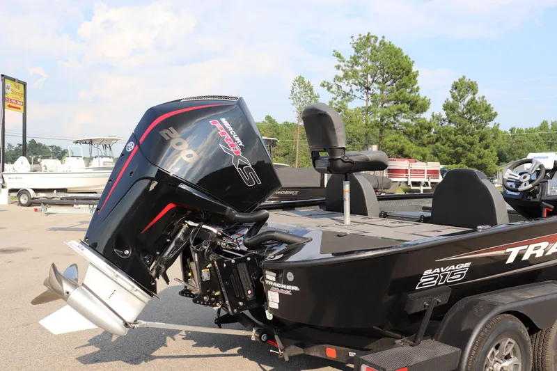 Slide: The Image of 2025 Tracker Savage 215 boat with Mercury Pro XS 200 engine in a parking lot. - 20