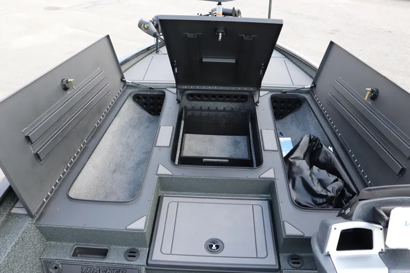 Slide: The Image of 2025 Tracker Savage 215 boat storage compartments open, showcasing ample space and organization. - 6