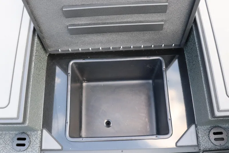 Slide: The Image of Open storage compartment in 2025 Tracker Savage 215 boat. - 9