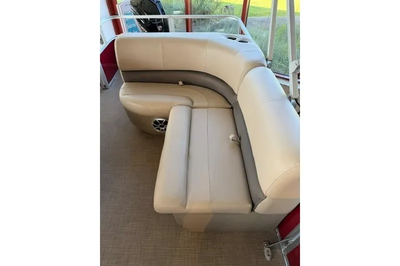 Slide: The Image of 2025 Sun Tracker Party Barge 18 DLX interior seating with beige upholstery. - 8