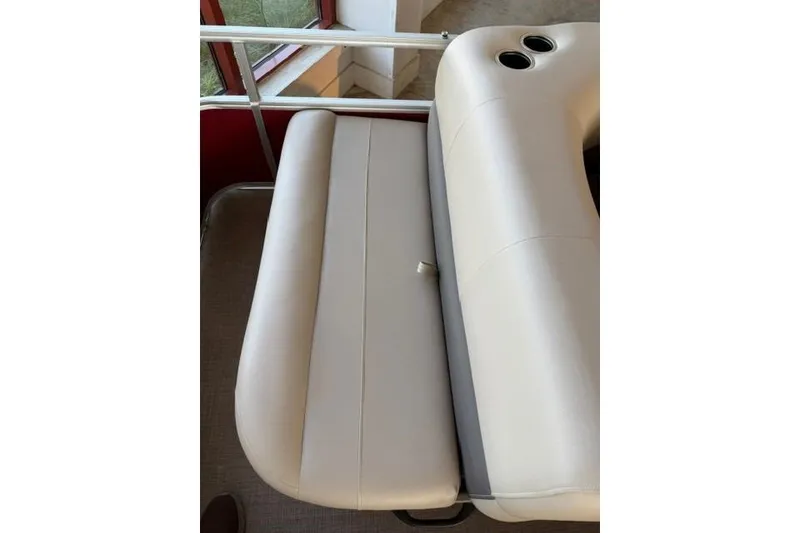 Slide: The Image of 2025 Sun Tracker Party Barge 18 DLX, beige seating with cup holders. - 11