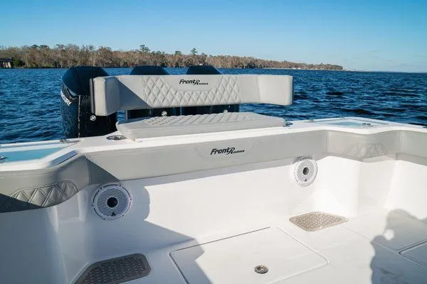 Slide: The Image of 2026 Front Runner 36 cc boat interior with seating, on a calm lake. - 17