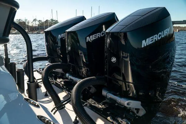 Slide: The Image of Triple Mercury outboard engines on a 2026 Front Runner 36 cc boat. - 18
