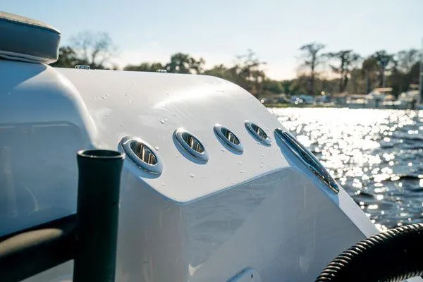 Slide: The Image of 2026 Front Runner 36 cc boat detail with water backdrop, showcasing sleek design and vents. - 20