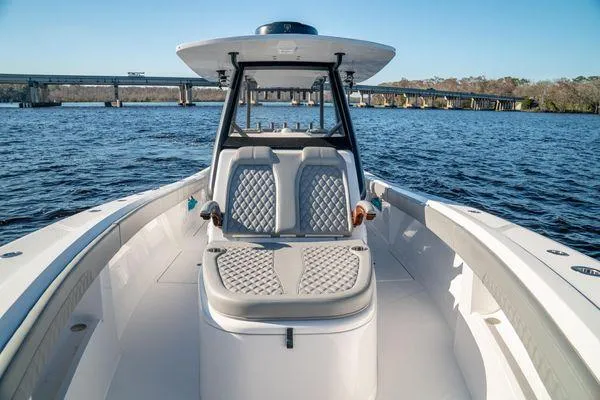 Slide: The Image of 2026 Front Runner 36 cc boat on water, featuring sleek seating and modern design. - 7