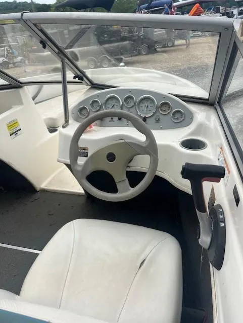 Slide: The Image of 2005 Bayliner 175 Bowrider dashboard with steering wheel and controls. - 5