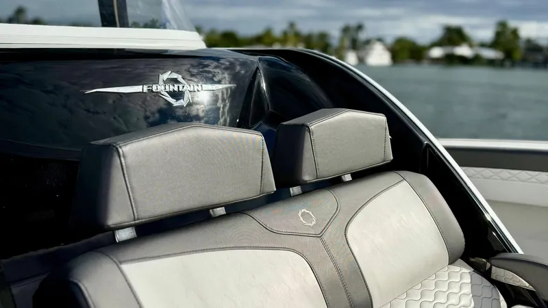 Slide: The Image of Luxury seating on a 2020 Fountain 43NX boat with stylish upholstery. - 16