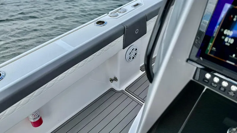 Slide: The Image of Interior view of a 2020 Fountain 43NX boat, featuring sleek design and modern controls. - 28