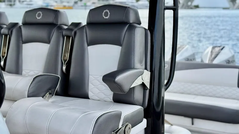 Slide: The Image of Luxury seating on a 2020 Fountain 43NX boat with stylish black and white upholstery. - 31