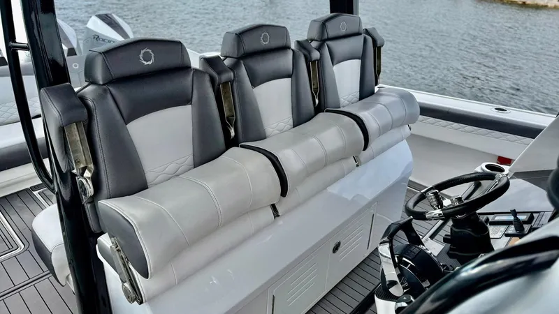 Slide: The Image of 2020 Fountain 43NX boat interior with luxurious seating and steering wheel. - 35