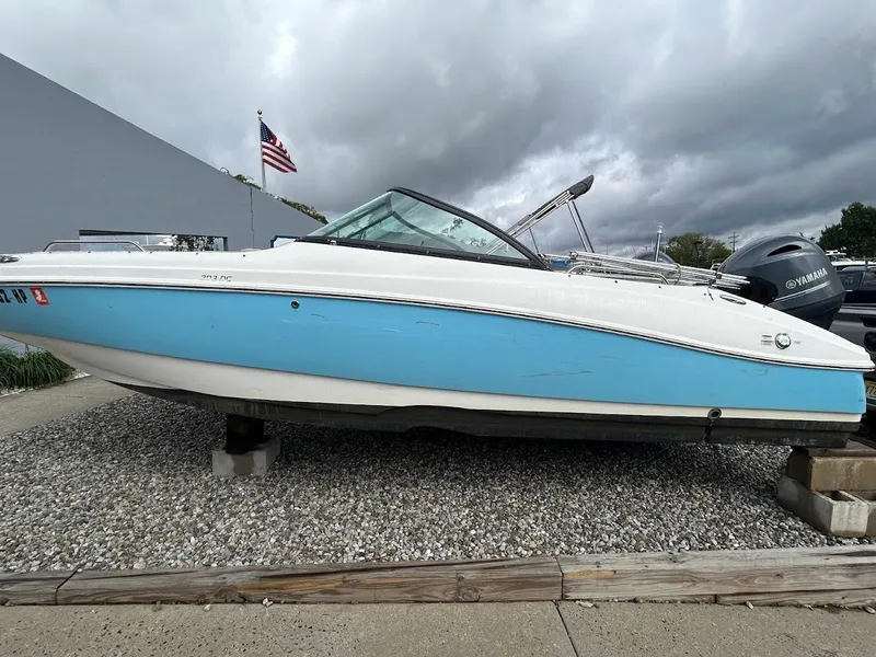 Slide: The Image of 2021 NauticStar 203 DC boat with blue and white hull on display. - 13