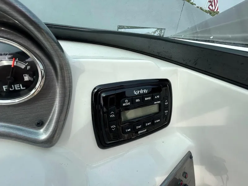 Slide: The Image of Infinity stereo system on 2021 NauticStar 203 DC boat dashboard. - 8
