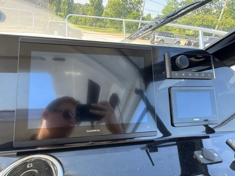 Slide: The Image of 2025 Jeanneau NC 795 Series 2 dashboard with Garmin and Yamaha displays. - 13