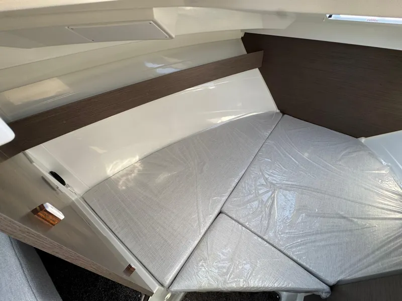 Slide: The Image of 2025 Jeanneau NC 795 Series 2 cabin interior with cushioned seating. - 18