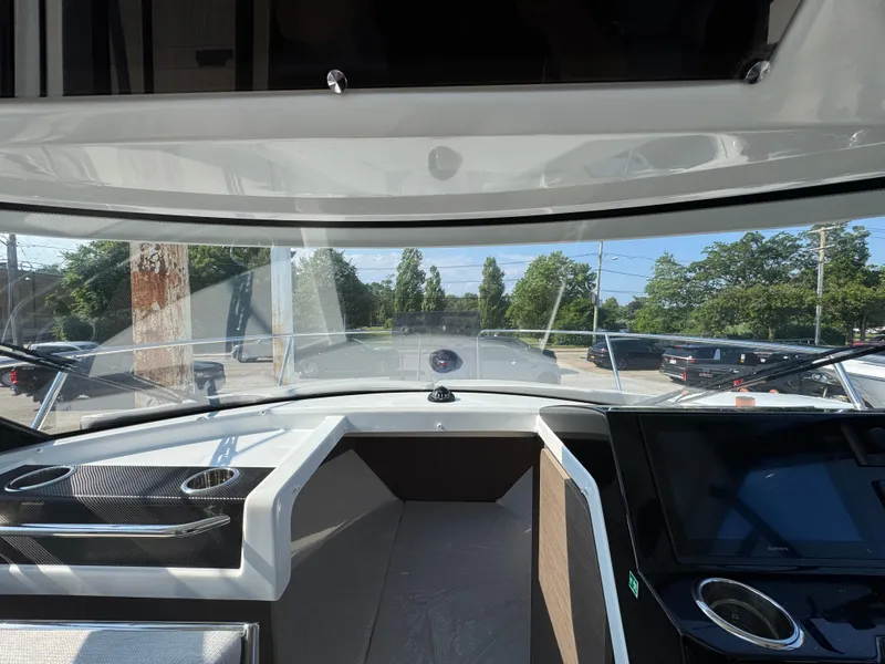 Slide: The Image of Interior view of 2025 Jeanneau NC 795 Series 2 boat cockpit with dashboard and windshield. - 20