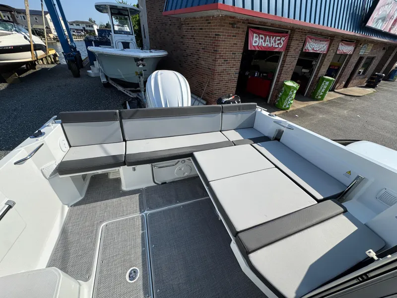 Slide: The Image of 2025 Jeanneau NC 795 Series 2 boat interior with spacious seating and modern design. - 25