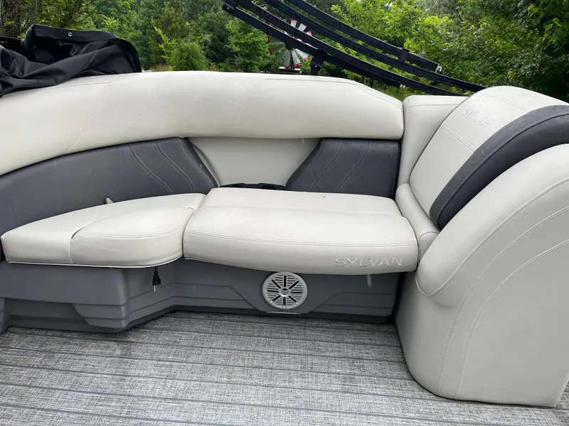 Slide: The Image of 2021 Sylvan Mirage X X3 boat interior with gray and white seating. - 7