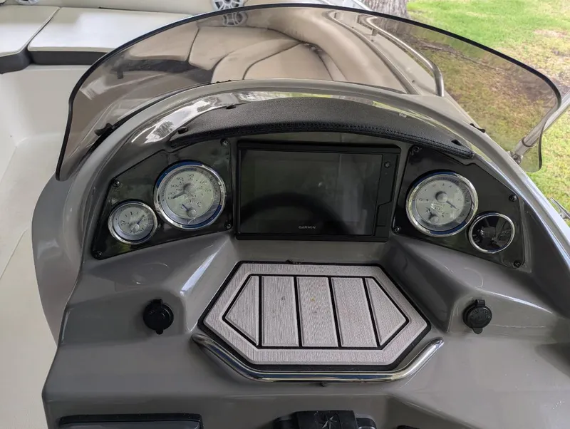 Slide: The Image of Dashboard of 2021 Stingray 192 SC boat with gauges and controls. - 7