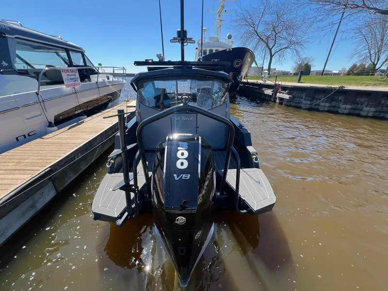 Slide: The Image of 2024 G-Force boat with V8 engine docked at marina, sunny day. - 4