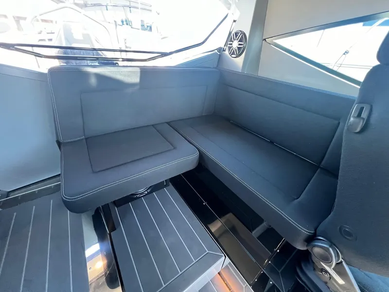 Slide: The Image of 2024 G-Force boat interior with sleek black seating and modern design elements. - 5