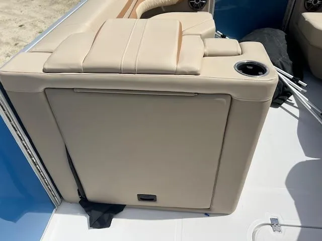 Slide: The Image of 2025 Hurricane FunDeck 2360 SBC OB boat seating with cup holder, beige upholstery. - 6