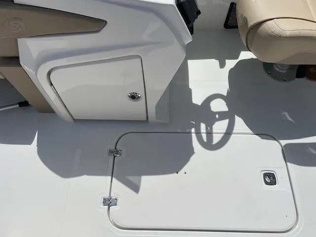 Slide: The Image of 2025 Hurricane FunDeck 2360 SBC OB boat interior with storage compartments and seating. - 9