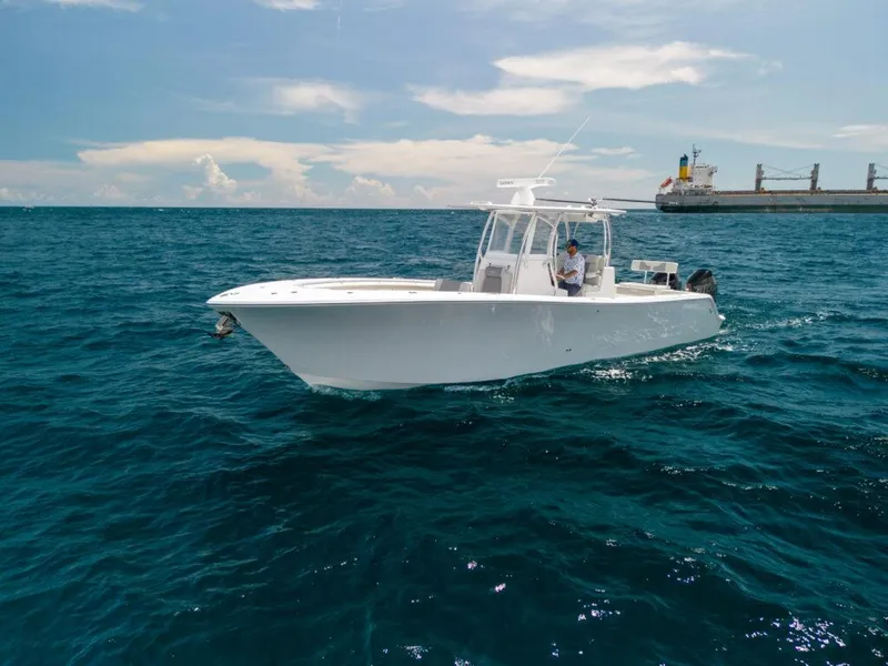 The Image of 2026 Front Runner 33 CC boat cruising on open ocean under clear sky. - 0