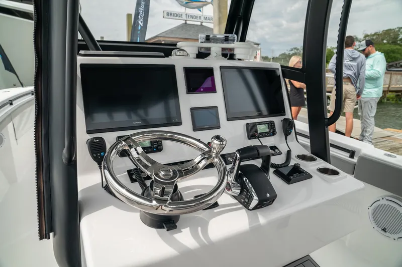 Slide: The Image of 2026 Front Runner 33 CC boat dashboard with modern navigation and control systems. - 14