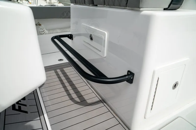 Slide: The Image of 2026 Front Runner 33 CC boat interior with sleek design and storage compartments. - 17