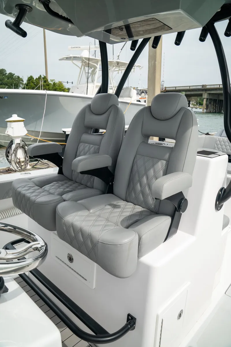 Slide: The Image of 2026 Front Runner 33 CC boat with luxurious gray leather seats and modern design. - 19