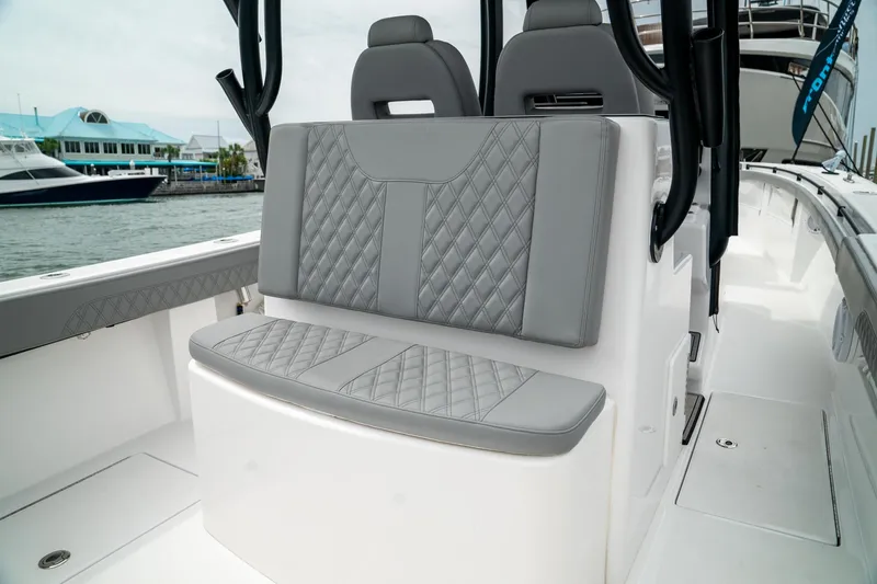 Slide: The Image of 2026 Front Runner 33 CC boat with stylish gray seating and quilted design. - 23