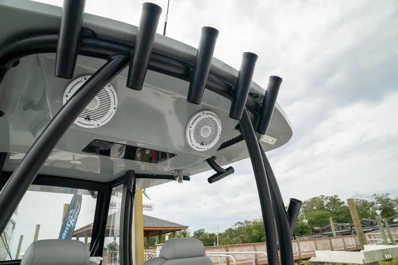 Slide: The Image of 2026 Front Runner 33 CC boat with rod holders and speakers on the canopy. - 28