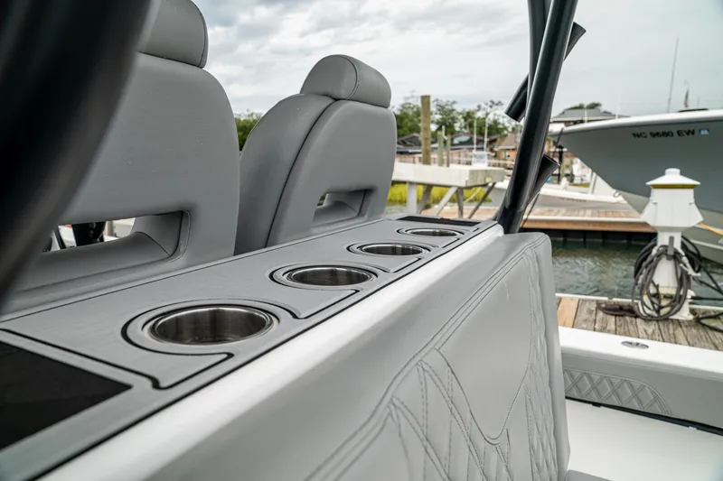 Slide: The Image of 2026 Front Runner 33 CC boat interior with cup holders and luxurious seating. - 31