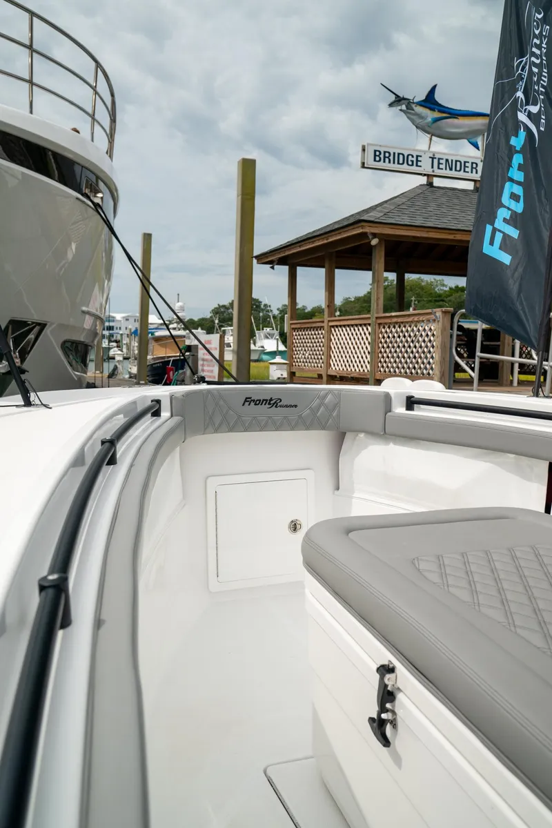 Slide: The Image of 2026 Front Runner 33 CC boat docked near Bridge Tender marina. - 7