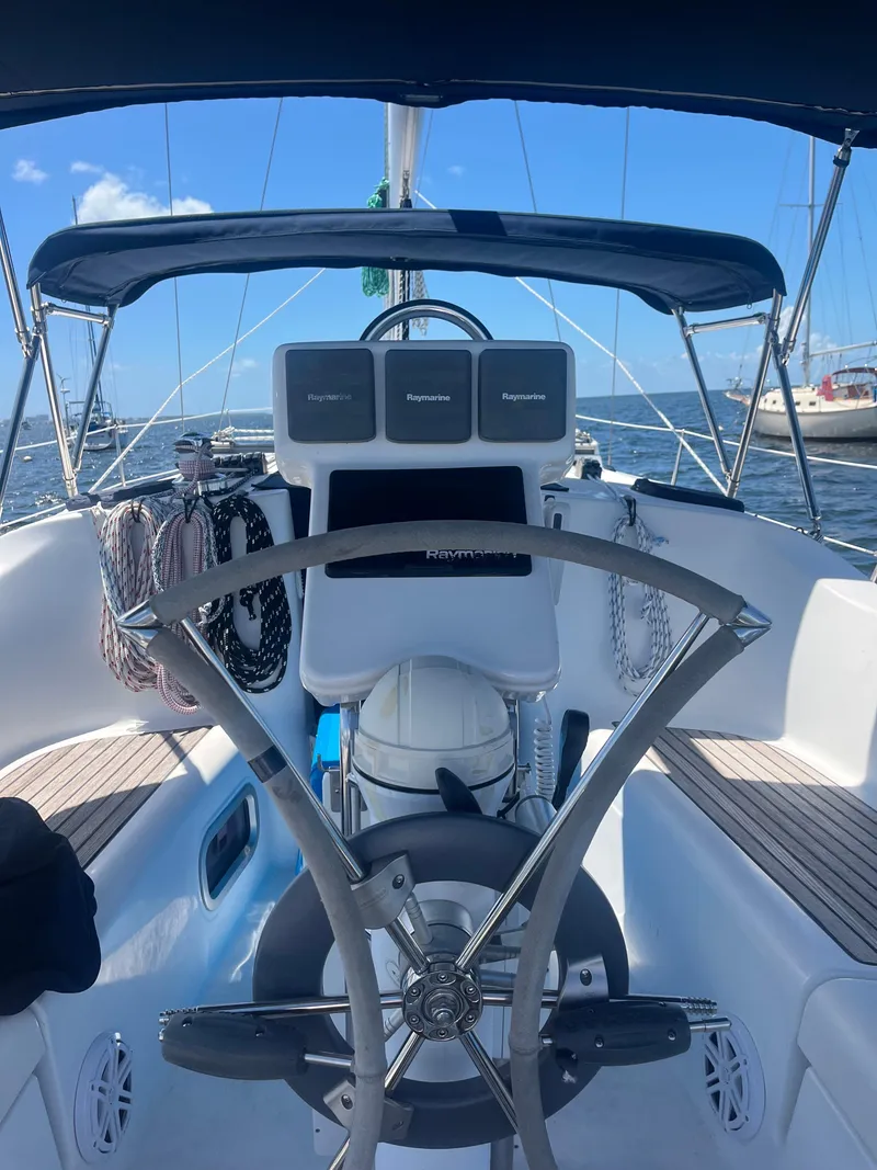 Slide: The Image of Cockpit view of 2007 Beneteau Oceanis Clipper 343 sailboat with steering wheel and navigation equipment. - 11