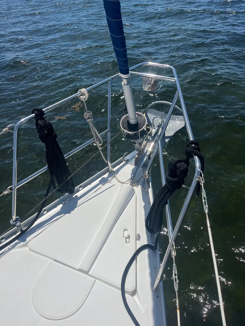 Slide: The Image of Bow of 2007 Beneteau Oceanis Clipper 343 sailboat on water, featuring anchor and rigging. - 12