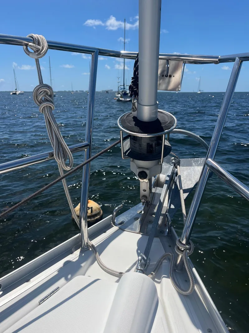 Slide: The Image of Bow of a 2007 Beneteau Oceanis Clipper 343 sailboat on calm water. - 22