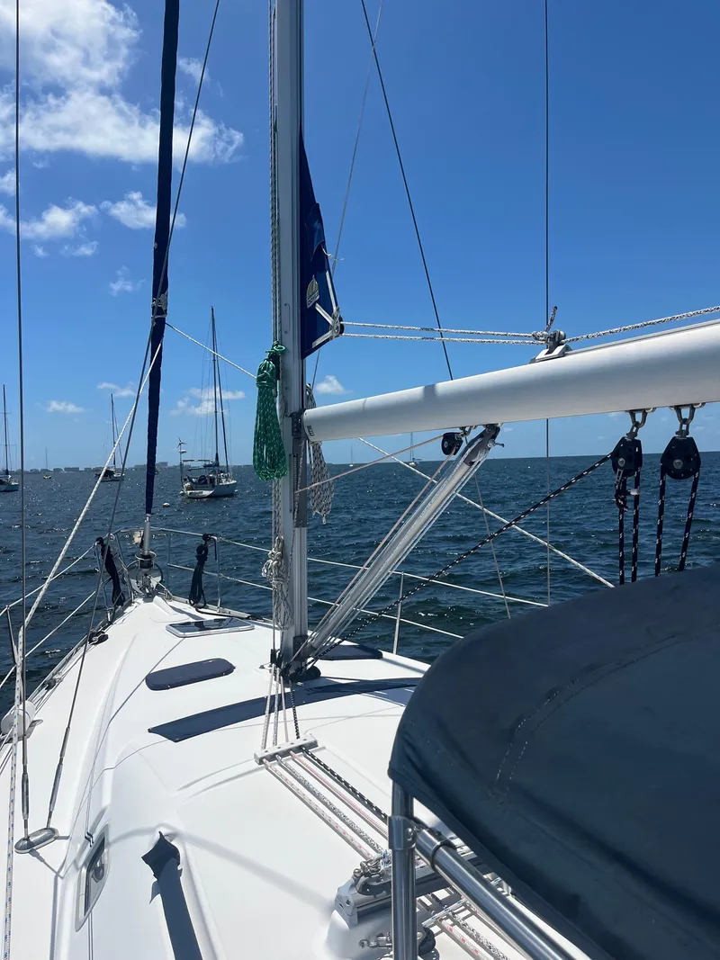 Slide: The Image of Sailing on a 2007 Beneteau Oceanis Clipper 343 under clear blue skies. - 32