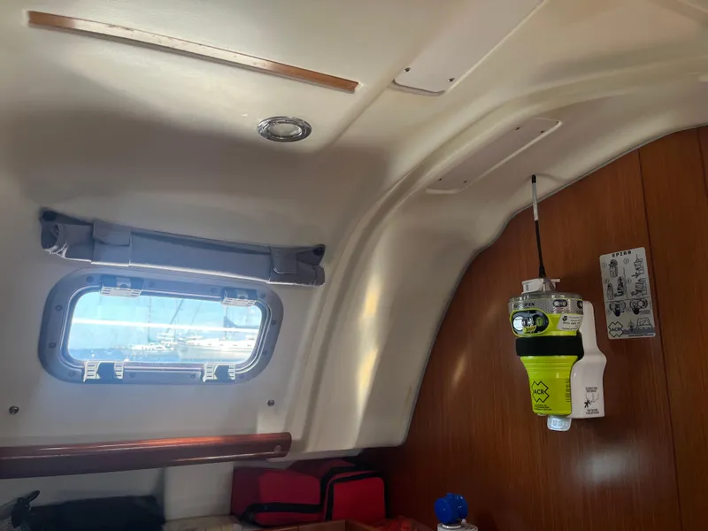 Slide: The Image of Interior of 2007 Beneteau Oceanis Clipper 343 with EPIRB device and porthole. - 40