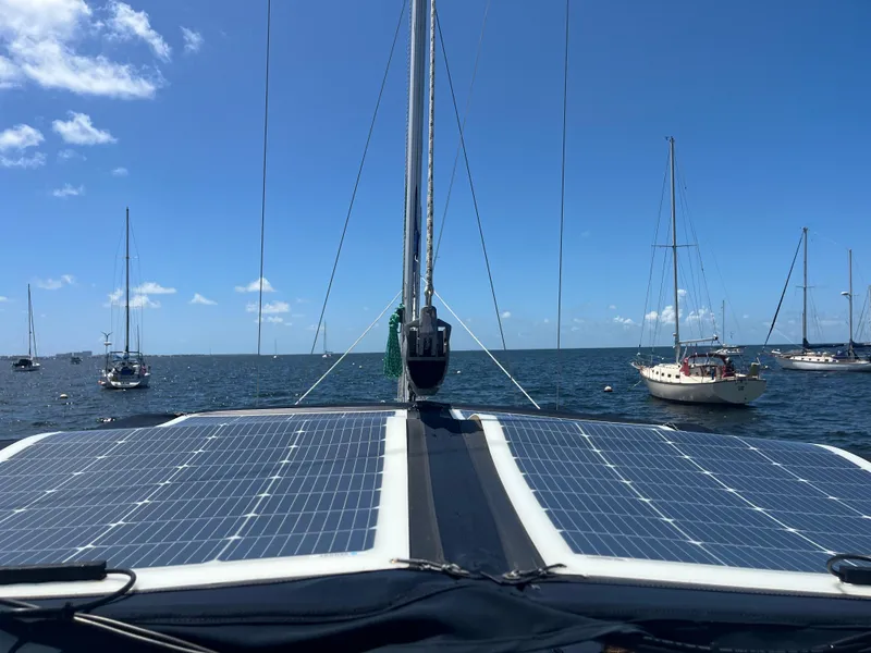 Slide: The Image of Sailboat with solar panels on deck, Beneteau Oceanis Clipper 343, 2007, anchored in sunny waters. - 43
