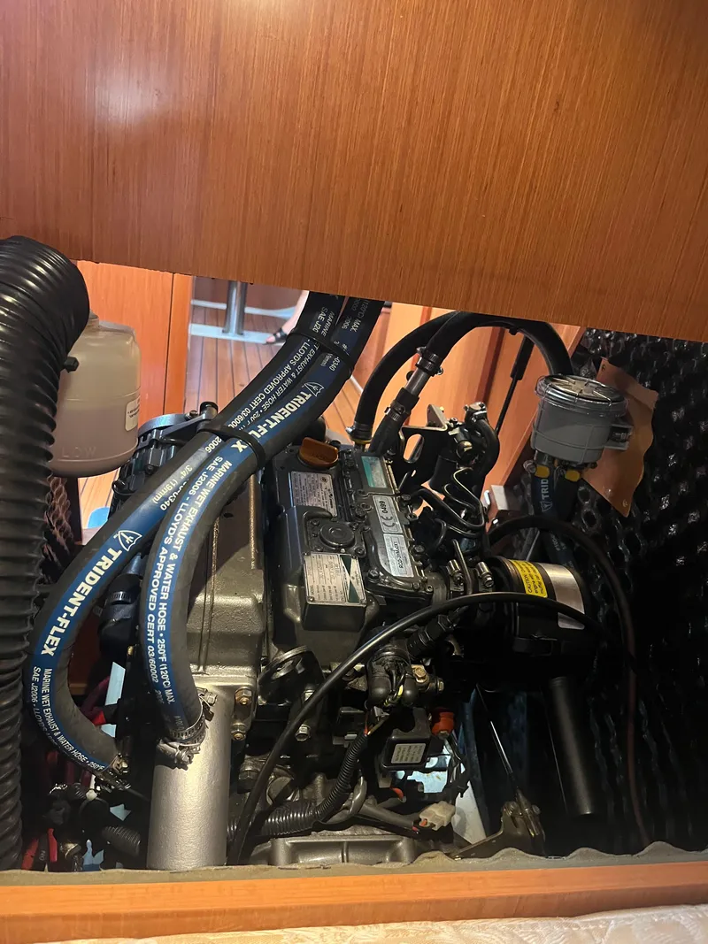 Slide: The Image of Engine compartment of a 2007 Beneteau Oceanis Clipper 343 sailboat, showcasing mechanical components. - 49