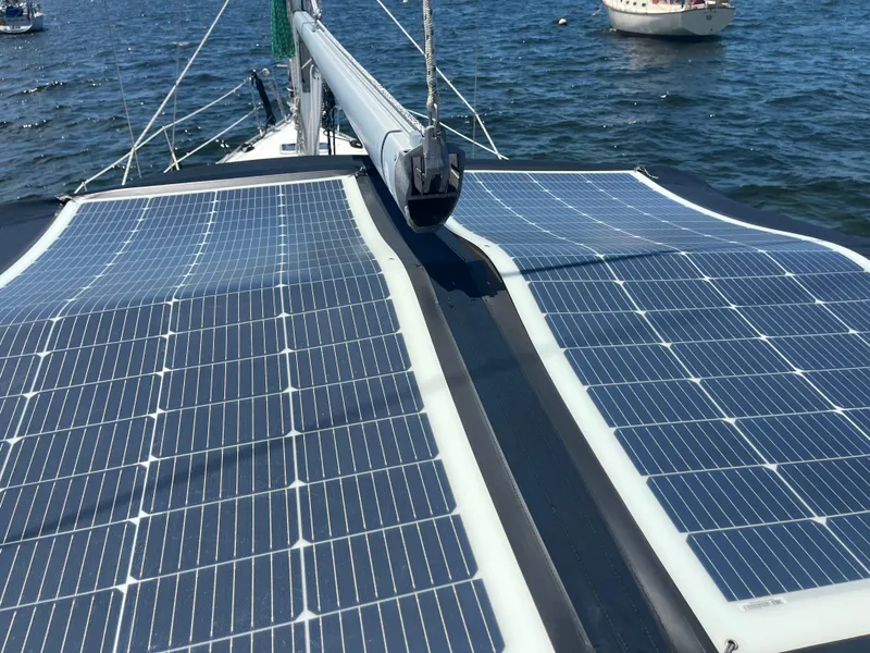 Slide: The Image of Solar panels on a 2007 Beneteau Oceanis Clipper 343 sailboat, harnessing renewable energy. - 6