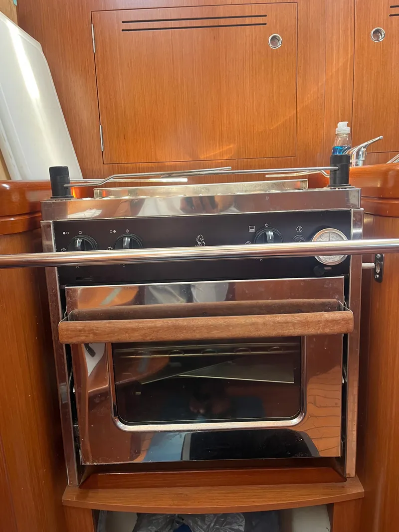 Slide: The Image of Galley kitchen in 2007 Beneteau Oceanis Clipper 343 yacht with stainless steel oven. - 7