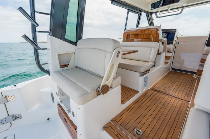 Slide: The Image of Interior of 2026 Boston Whaler 405 Conquest with luxurious seating area. - 10